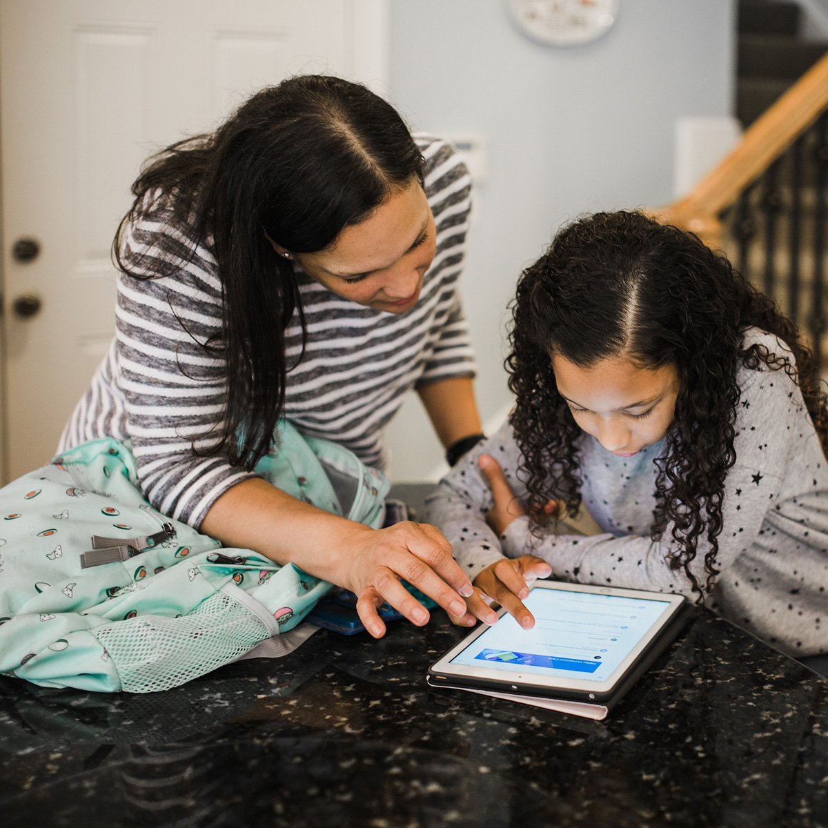 Parent with child at home learning